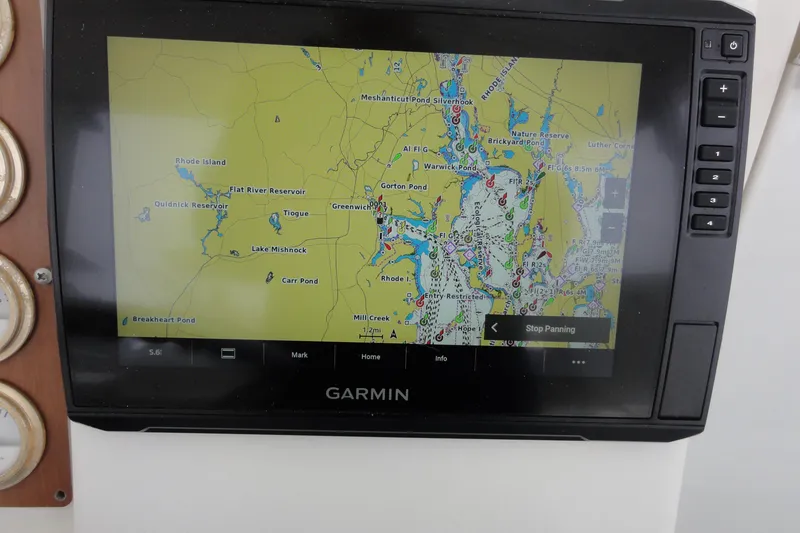 Slide: The Image of Garmin navigation display on 2002 Rampage 30 Open boat, showing detailed marine map. - 19