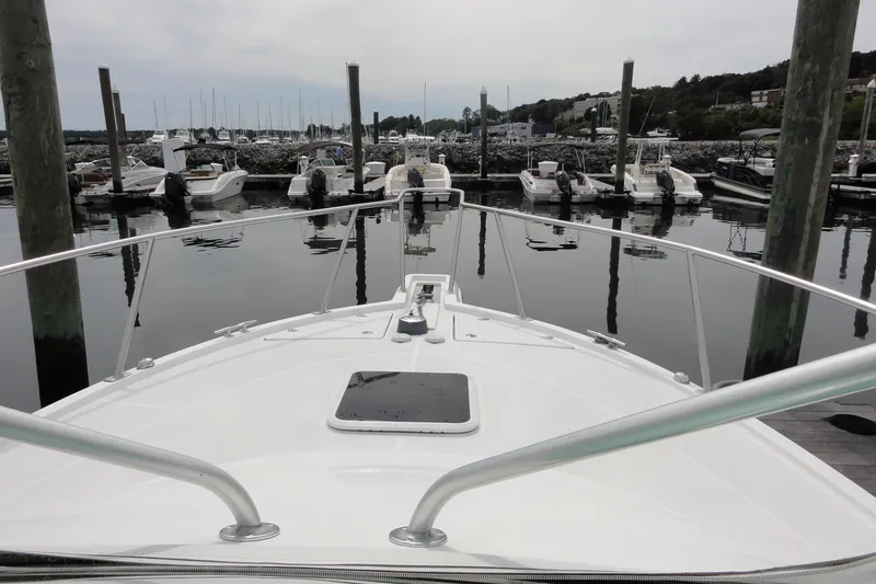 Slide: The Image of Bow view of 2002 Rampage 30 Open boat docked in a marina. - 20
