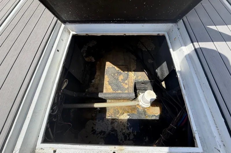 Slide: The Image of Open hatch of 1981 T Craft Gulfstream 30 boat, showing interior components and wiring. - 11