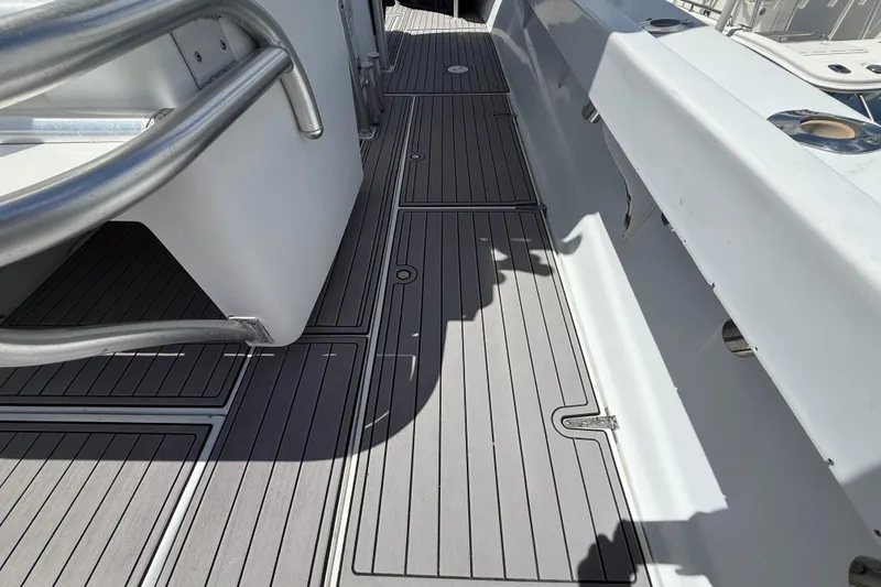 Slide: The Image of 1981 T Craft Gulfstream 30 boat deck with sleek, modern design and metal railings. - 12