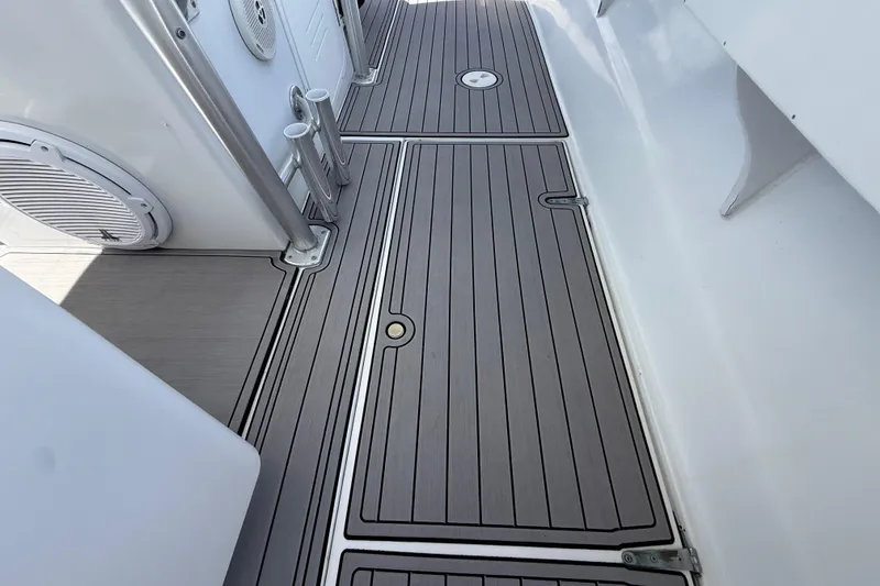 Slide: The Image of 1981 T Craft Gulfstream 30 boat deck with sleek, modern design and durable flooring. - 13