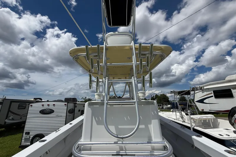 Slide: The Image of 1981 T Craft Gulfstream 30 boat with tower, under a partly cloudy sky. - 16