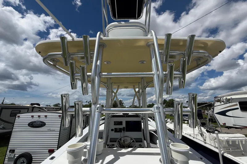 Slide: The Image of 1981 T Craft Gulfstream 30 boat with tower, rod holders, and clear sky background. - 17