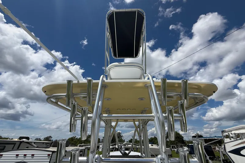 Slide: The Image of 1981 T Craft Gulfstream 30 boat with tower against a cloudy sky backdrop. - 18