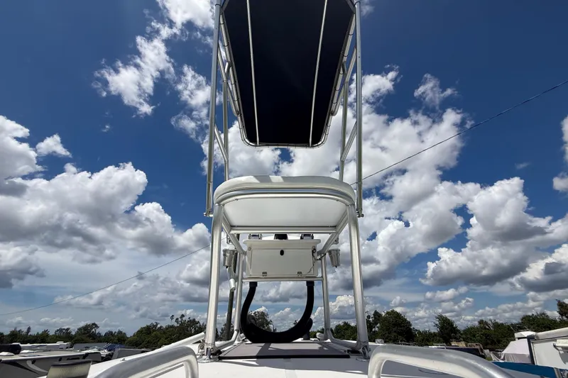 Slide: The Image of T Craft Gulfstream 30 boat tower against a cloudy blue sky, 1981 model. - 19