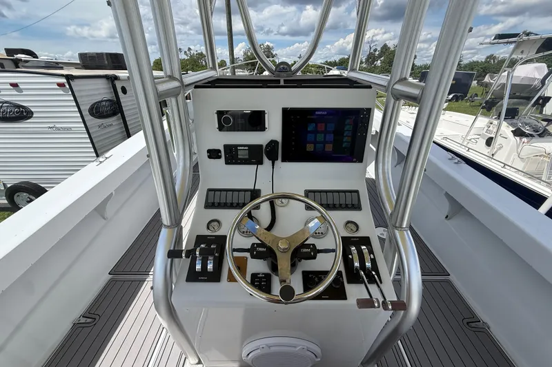 Slide: The Image of 1981 T Craft Gulfstream 30 boat cockpit with steering wheel and navigation controls. - 27