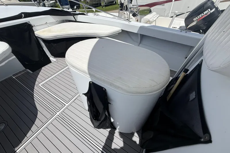 Slide: The Image of 1981 T Craft Gulfstream 30 boat interior with cushioned seating and deck details. - 37
