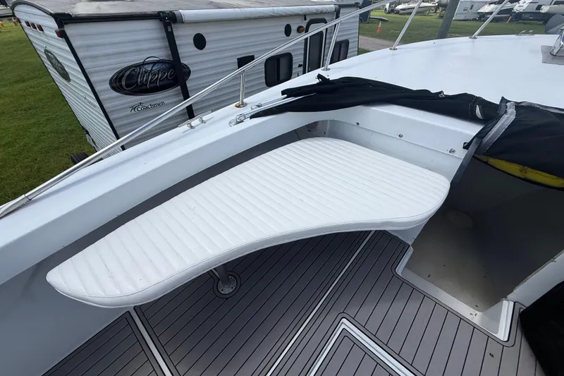 Slide: The Image of 1981 T Craft Gulfstream 30 boat deck with white seating and railing. - 41