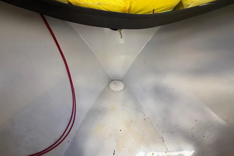 Slide: The Image of Interior of 1981 T Craft Gulfstream 30 boat, featuring clean white surfaces and red cable. - 45