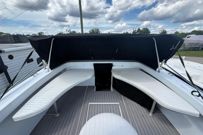Slide: The Image of 1981 T Craft Gulfstream 30 boat interior with white seating and black canopy. - 47