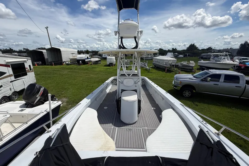 Slide: The Image of 1981 T Craft Gulfstream 30 boat in storage yard with other vehicles and boats. - 54