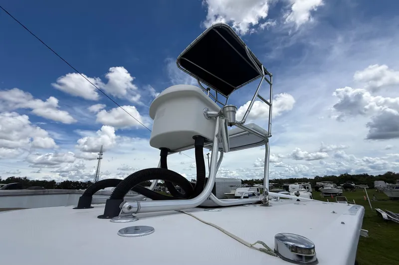 Slide: The Image of 1981 T Craft Gulfstream 30 boat deck with equipment under a cloudy sky. - 57
