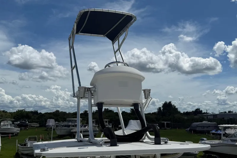 Slide: The Image of 1981 T Craft Gulfstream 30 boat with tower against a cloudy sky backdrop. - 58