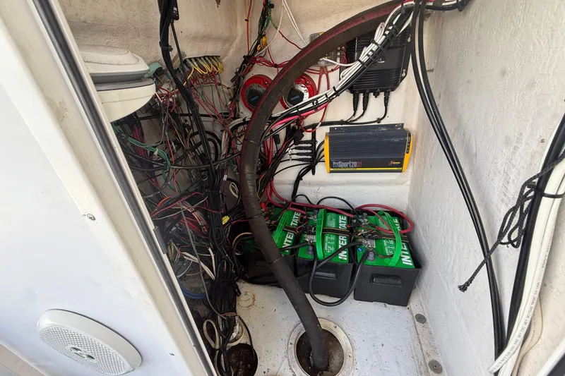 Slide: The Image of Electrical wiring and battery setup inside a 1981 T Craft Gulfstream 30 boat. - 62