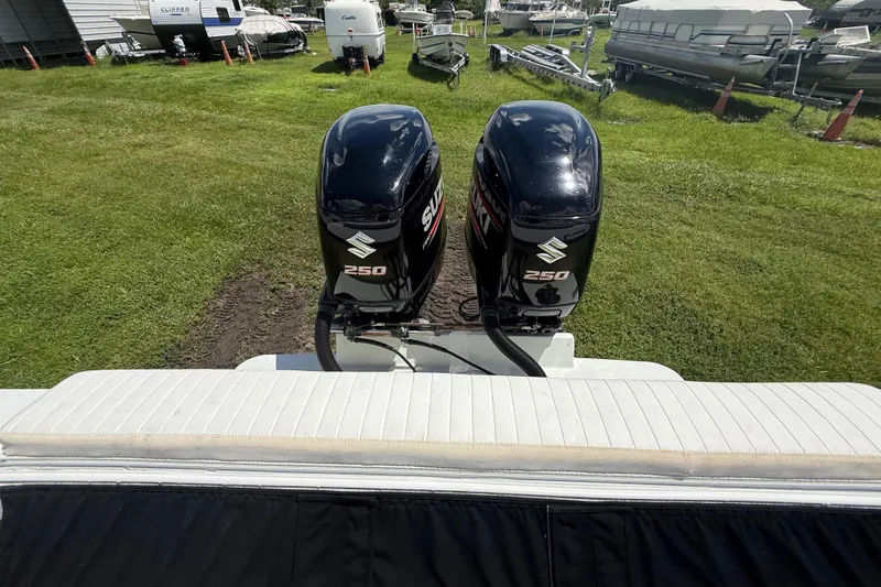 Slide: The Image of Twin Suzuki 250 outboard motors on a 1981 T Craft Gulfstream 30 boat. - 69