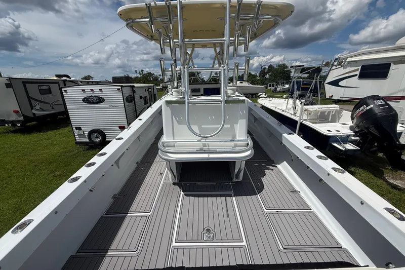 Slide: The Image of 1981 T Craft Gulfstream 30 boat with spacious deck and modern fittings, parked outdoors. - 9