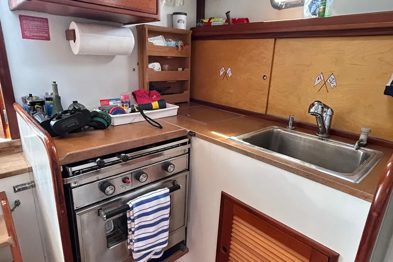 Slide: The Image of Cozy kitchen in 1994 John Williams Stanley 36 boat with stove and sink. - 10
