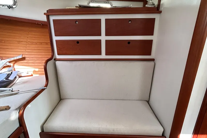 Slide: The Image of Interior of 1994 John Williams Stanley 36 boat with wooden drawers and cushioned seating. - 11