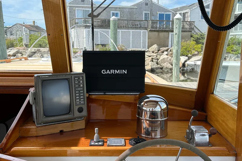 Slide: The Image of Boat cockpit with Garmin navigation, vintage Furuno radar, and classic controls, John Williams Stanley 36, 1994. - 5