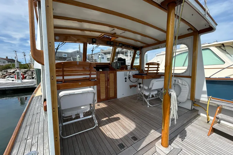 Slide: The Image of Interior view of a 1994 John Williams Stanley 36 boat with wooden accents and seating. - 6