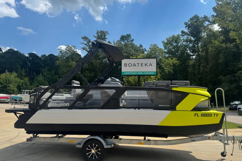 The Image of 2024 Sea-Doo Switch Cruise 21 pontoon boat on trailer, certified pre-owned at Boateka. - 0