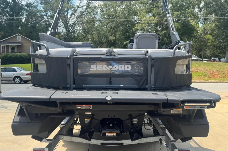 Slide: The Image of 2024 Sea-Doo Switch Cruise 21 pontoon boat on trailer, rear view. - 7