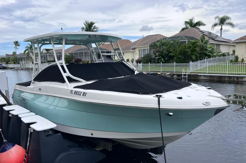 Slide: The Image of 2019 Robalo R247 Dual Console boat docked in a residential canal. - 15