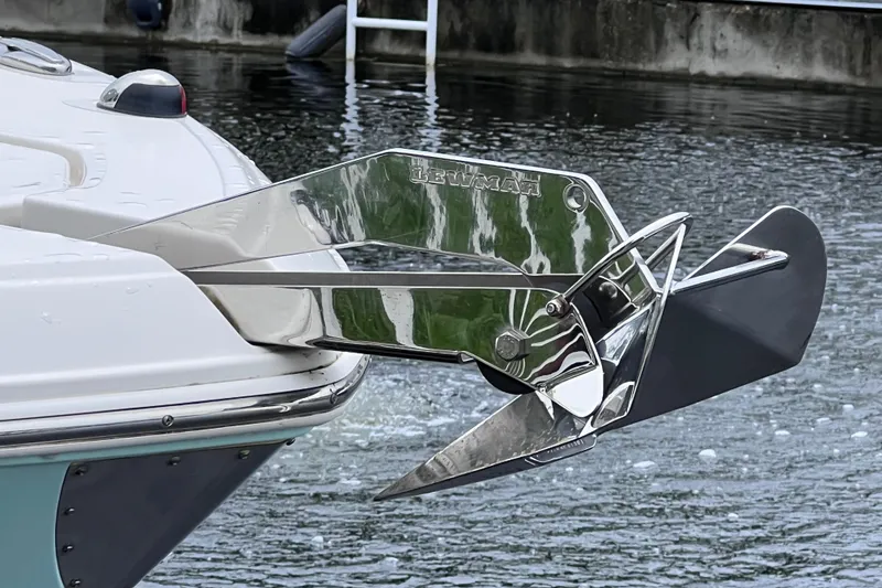 Slide: The Image of 2019 Robalo R247 Dual Console boat with polished stainless steel anchor in water. - 18