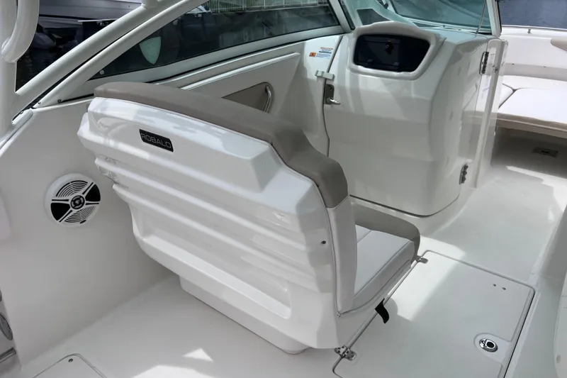 Slide: The Image of 2019 Robalo R247 Dual Console boat interior with seating and dashboard view. - 46