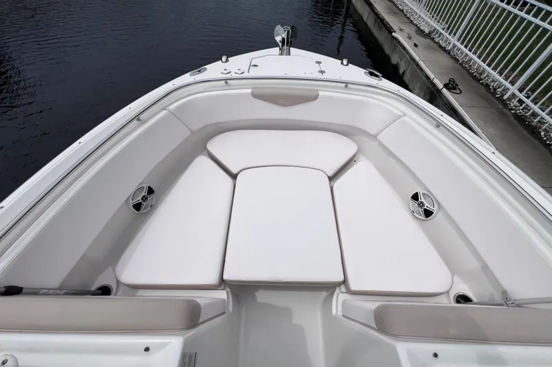 Slide: The Image of 2019 Robalo R247 Dual Console boat with spacious bow seating and sleek design. - 52