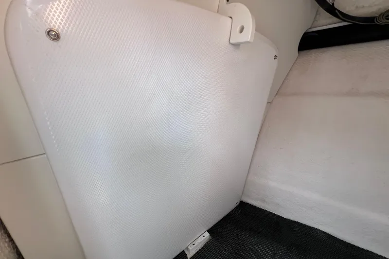Slide: The Image of Interior detail of 2019 Robalo R247 Dual Console boat, featuring textured white paneling. - 63