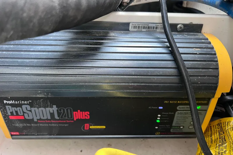 Slide: The Image of ProMariner ProSport 20 Plus marine battery charger in a 2019 Robalo R247 Dual Console boat. - 64