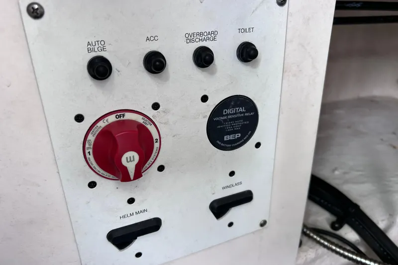 Slide: The Image of Control panel of a 2019 Robalo R247 Dual Console boat with switches and digital relay. - 66