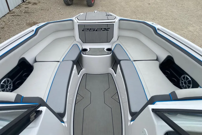 Slide: The Image of 2021 Yamaha Boats 252XE interior with spacious seating and modern design. - 10