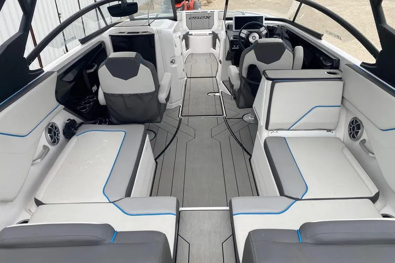 Slide: The Image of 2021 Yamaha Boats 252XE interior with modern seating and sleek design. - 6