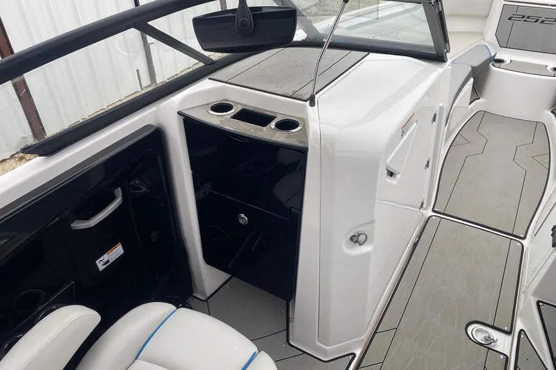 Slide: The Image of 2021 Yamaha Boats 252XE interior with sleek design and modern amenities. - 9