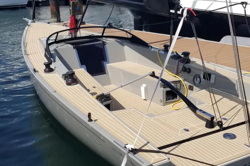 Slide: The Image of 2025 Saffier Se 27 Leisure sailboat with sleek deck design, docked in marina. - 2