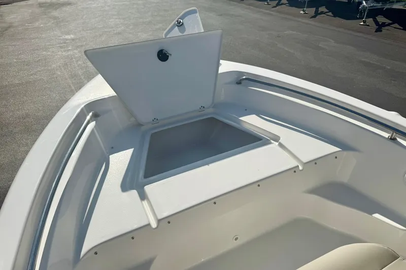 Slide: The Image of 2026 Key West 189 FS boat with open storage compartment on deck. - 12