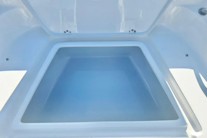 Slide: The Image of Storage compartment of 2026 Key West 189 FS boat, open and empty. - 13