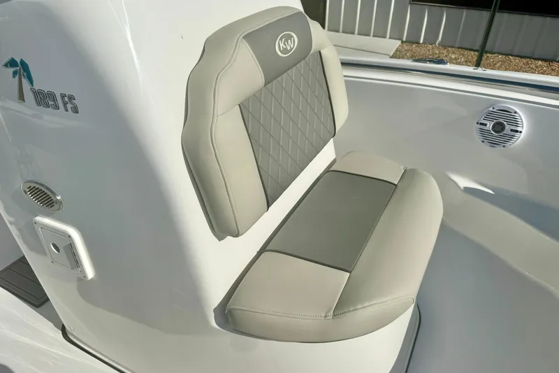 Slide: The Image of 2026 Key West 189 FS boat seat with gray upholstery and logo detail. - 15