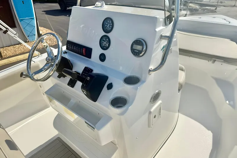 Slide: The Image of 2026 Key West 189 FS boat console with steering wheel and gauges. - 17