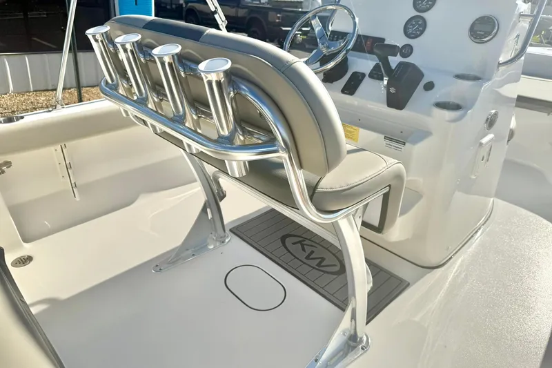 Slide: The Image of 2026 Key West 189 FS boat interior with helm, rod holders, and seating. - 21