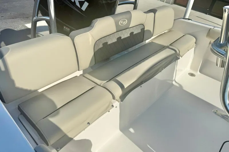 Slide: The Image of 2026 Key West 189 FS boat interior with beige cushioned seating. - 22