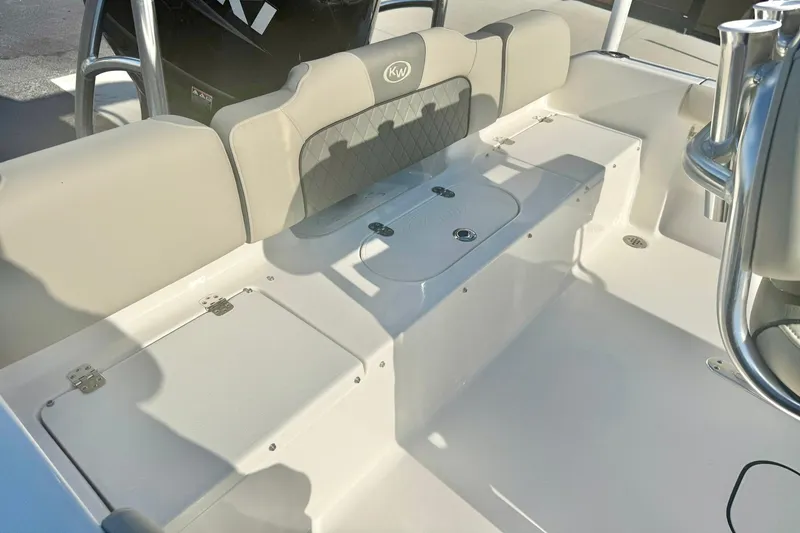 Slide: The Image of 2026 Key West 189 FS boat interior with cushioned seating and storage compartments. - 23