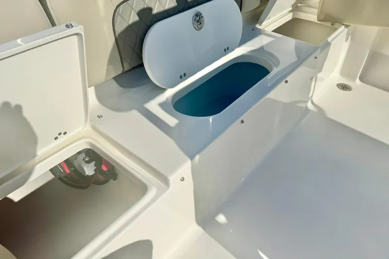 Slide: The Image of 2026 Key West 189 FS boat interior with storage compartments and seating. - 24