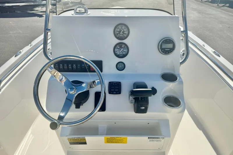 Slide: The Image of 2026 Key West 189 FS boat console with steering wheel, gauges, and controls. - 3