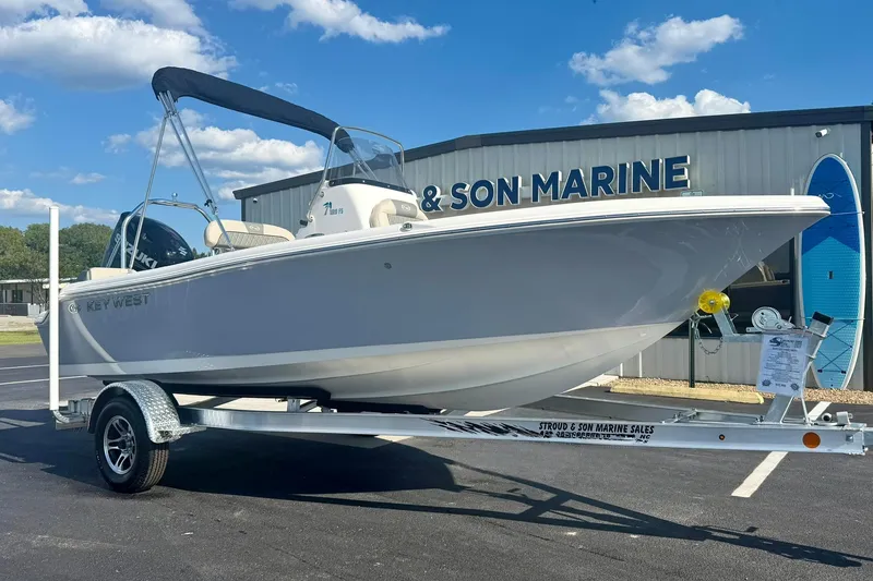 Slide: The Image of 2026 Key West 189 FS boat on trailer at marine dealership. - 4