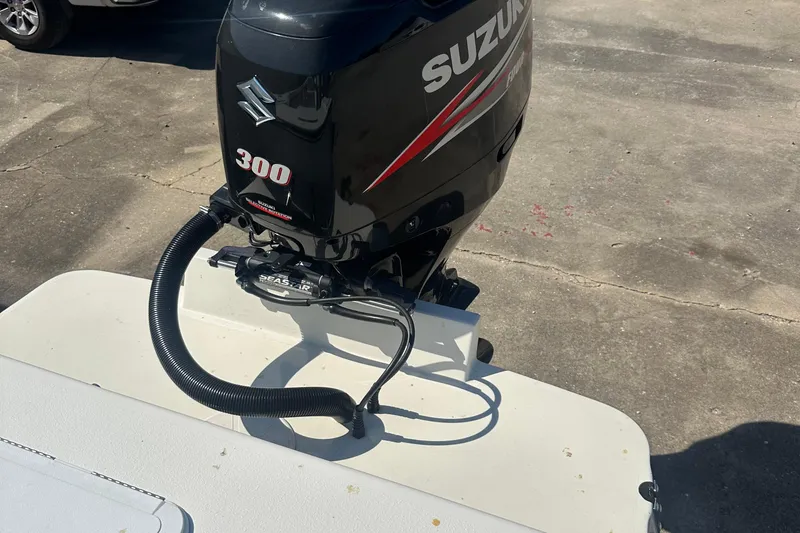 Slide: The Image of 2017 May-Craft 2550CCX with Suzuki 300 outboard motor on a concrete surface. - 41