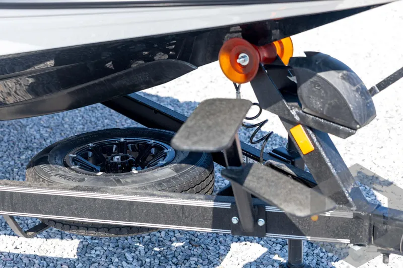Slide: The Image of Trailer detail of 2026 Skeeter ZXE21 boat with spare tire and step. - 11