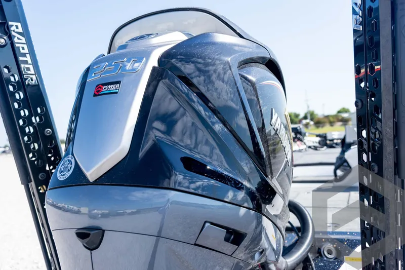 Slide: The Image of 2026 Skeeter ZXE21 boat with Yamaha 250 engine, featuring Raptor power poles. - 21